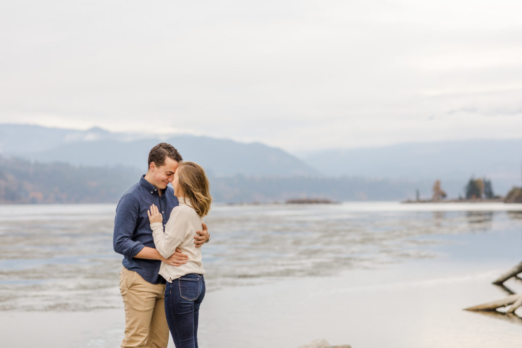 Columbia River Gorge engagement session standing along the river. 
